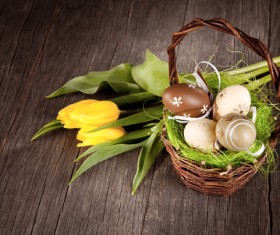 Easter eggs and flowers in the desktop basket Stock Photo 01