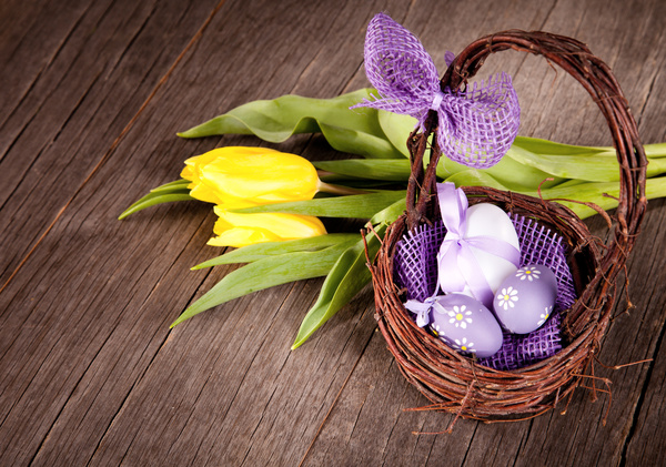 Easter eggs and flowers in the desktop basket Stock Photo 03