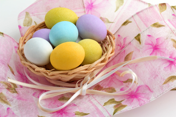 Easter eggs in the desktop basket Stock Photo
