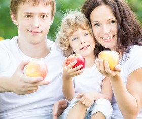Family with fruit in hand Stock Photo