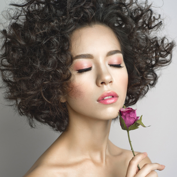 Fashion curly woman with rose flower Stock Photo 02