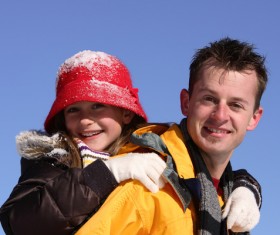 Father carrying daughter Stock Photo