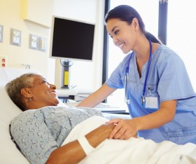 Female doctor asked condition Stock Photo