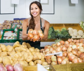 Female traders selling onions Stock Photo