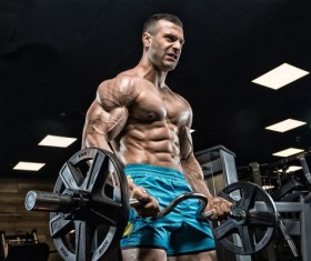 Fitness man lifting barbell Stock Photo