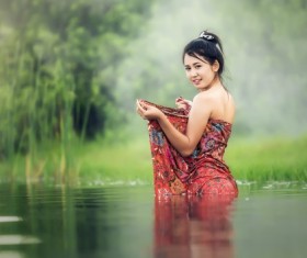 Girl bathing in the stream Stock Photo