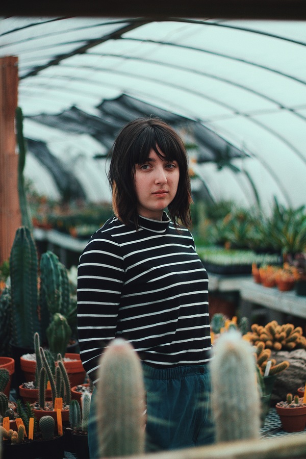 Girl in the greenhouse Stock Photo