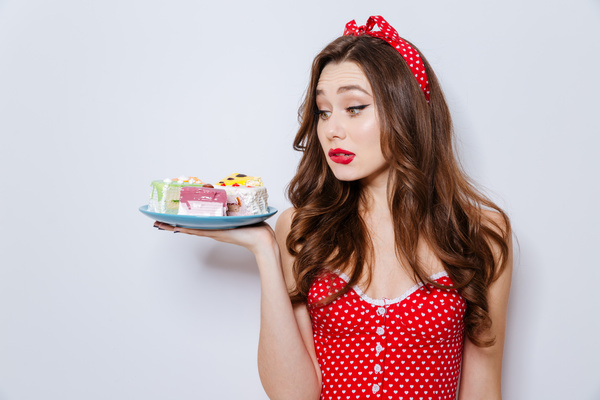 Girl looking at desserts Stock Photo
