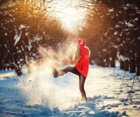 Girl playing with snow outdoor in winter Stock Photo
