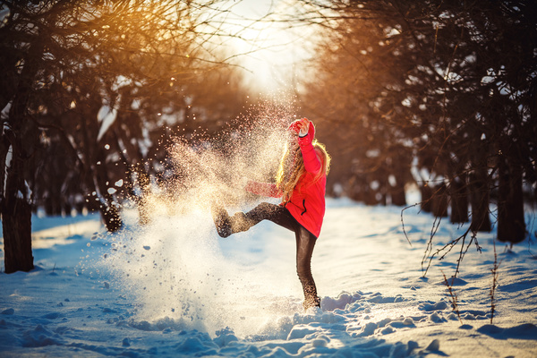 Girl playing with snow outdoor in winter Stock Photo