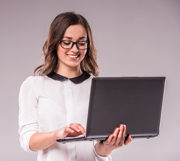 Girl using using laptop Stock Photo