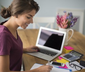 Girl working with laptop at work Stock Photo 02