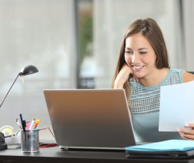 Girl working with laptop at work Stock Photo 03