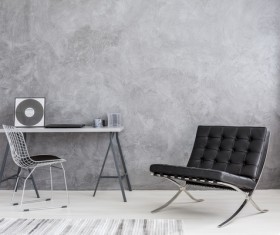 Gray wall and black sofa indoor Stock Photo
