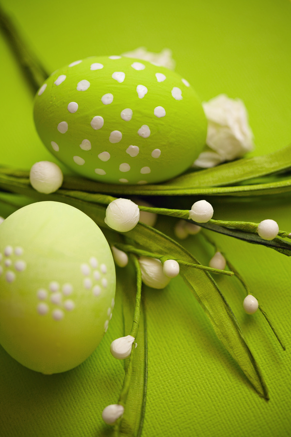 Green Easter eggs with paper flowers Stock Photo