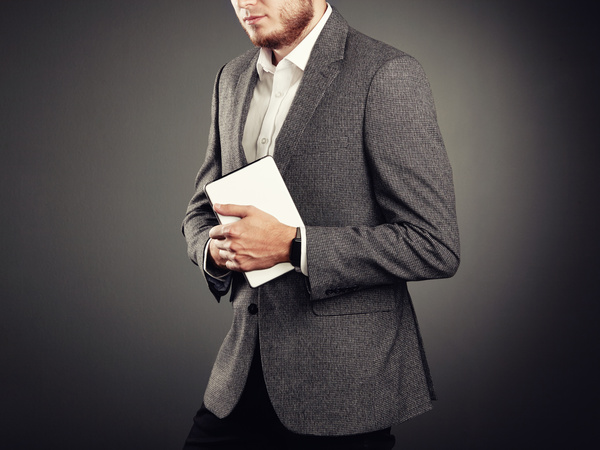 Handsome young man in business suit holding tablet PC Stock Photo 01