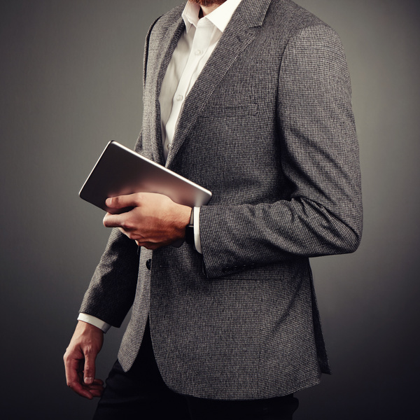 Handsome young man in business suit holding tablet PC Stock Photo 02