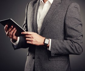 Handsome young man in business suit holding tablet PC Stock Photo 04