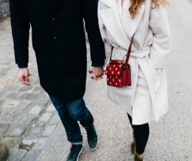 Happy couple hand in hand on road Stock Photo