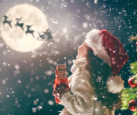 Happy girl holding Christmas gift Stock Photo 02