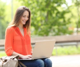 Happy girl using laptop Stock Photo 02