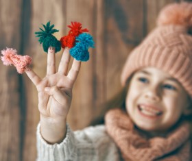 Happy little girl holding knitwear Stock Photo 02