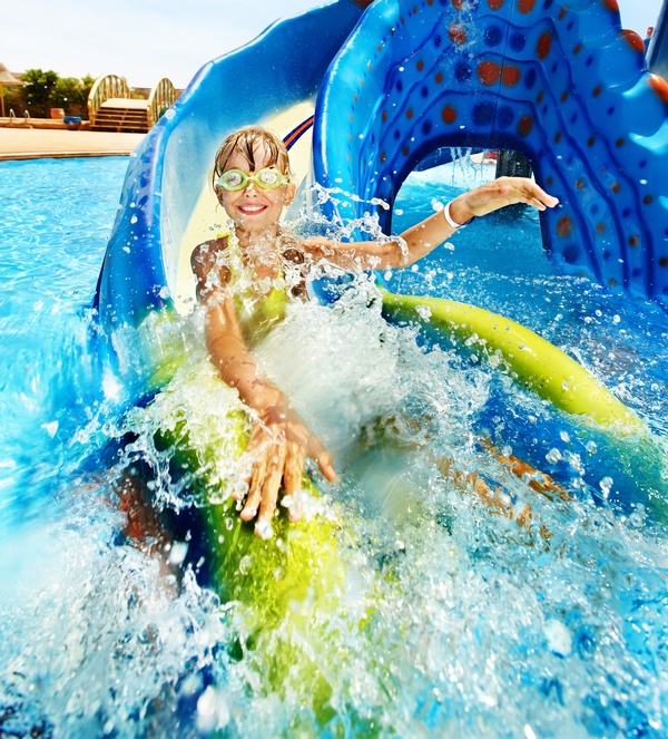 Happy little girl playing in water amusement park Stock Photo 01