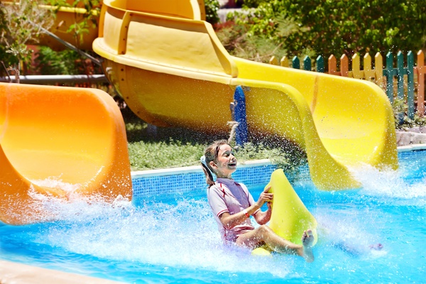 Happy little girl playing in water amusement park Stock Photo 04