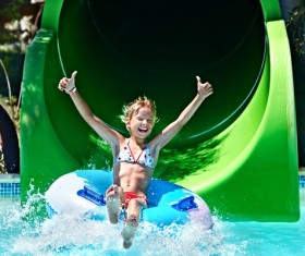 Happy little girl playing in water amusement park Stock Photo 05