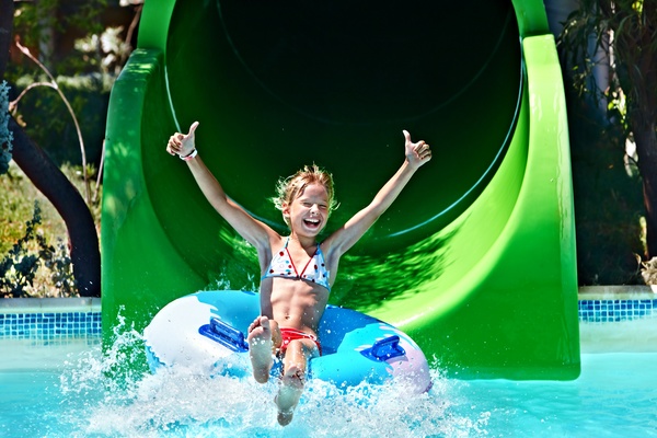 Happy little girl playing in water amusement park Stock Photo 05