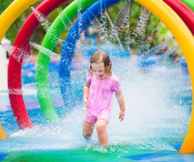 Happy little girl playing in water amusement park Stock Photo 06