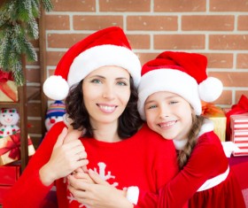 Happy mother and daughter wearing Christmas costume Stock Photo