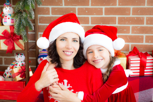 Happy mother and daughter wearing Christmas costume Stock Photo