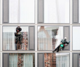High-rise building exterior cleaning spider-man Stock Photo