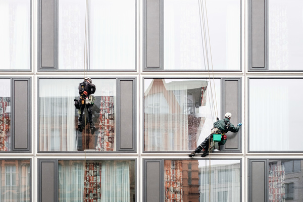 High-rise building exterior cleaning spider-man Stock Photo