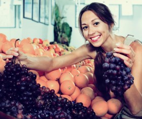 Housewife buy grapes Stock Photo