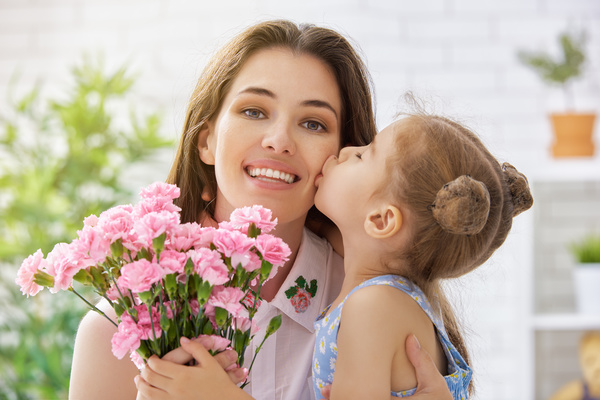 Kiss of Mother's Day daughter Stock Photo