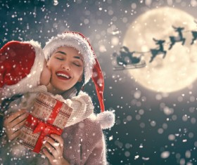 Kissing Moms daughter on Christmas day Stock Photo