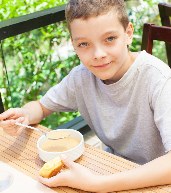 Little boy eating lunch Stock Photo