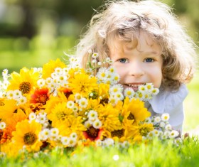 Little girl and flowers Stock Photo