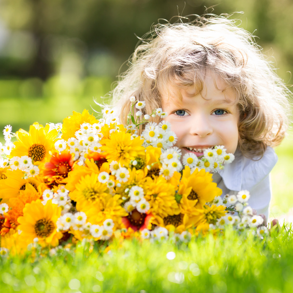 Little girl and flowers Stock Photo