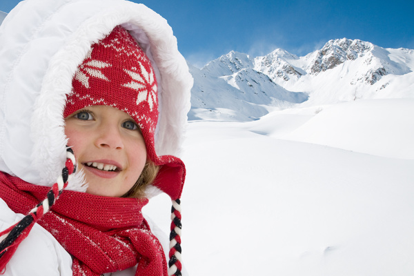 Little girl having fun in ski resort Stock Photo