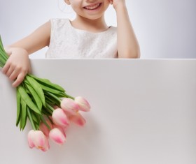 Little girl holding flowers Stock Photo