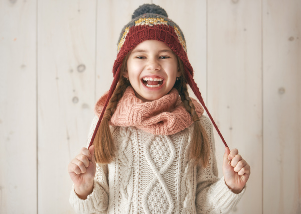 Little girl in knit sweater Stock Photo