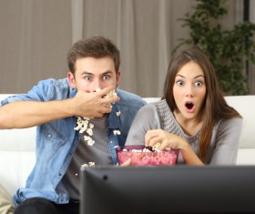 Lovers watching TV Stock Photo 01