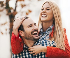 Man carrying girlfriend happy Stock Photo
