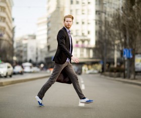Man crossing the road Stock Photo