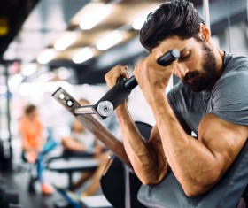 Man exercising Musculus biceps brachii Stock Photo