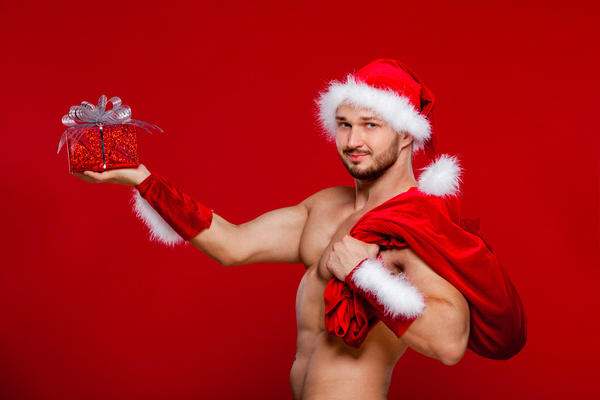 Man holding Christmas present Stock Photo