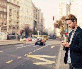 Man playing cell phone Stock Photo